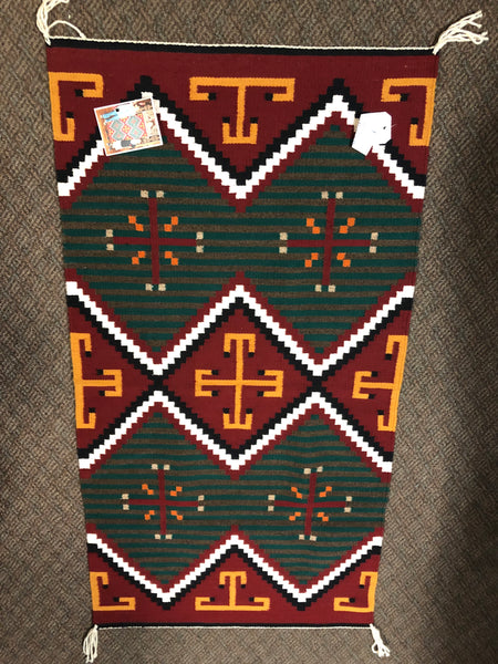 Authentic Navajo Handwoven wool rug, 26.5” x 49”.
