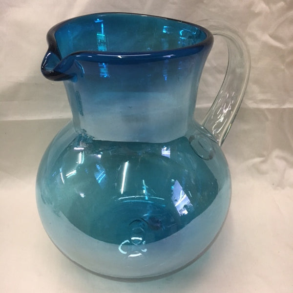 Hand blown glass pitcher in solid aquamarine color with  clear glass handle