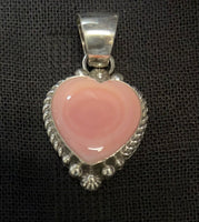 Navajo handcrafted by Robert Shakey 1.5” from top to bottom.  Pink Conch shell in sterling silver. NM105