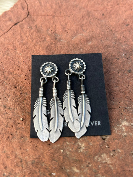 Sharon McCarthy, Navajo silversmith made these earrings in sterling silver.  NM150