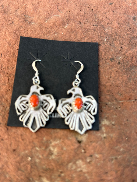 Paige Gordon, Navajo, made these coral and sterling silver earrings. NM151