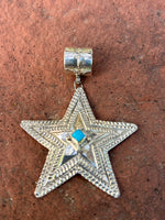 June Delgarito made this star pendant with sterling silver and genuine turquoise NM153
