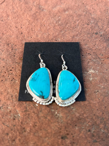 Verley Betone, Navajo handcrafted these genuine turquoise and sterling silver earrings. NM163
