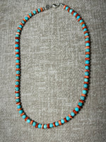 Natural turquoise round bead and Spiney oyster shell disc necklace in 18” length.  Sterling silver lobster claw clasp