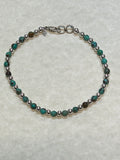 Natural African 4 mm stone beads with sterling silver.  7.5” bracelet SR111