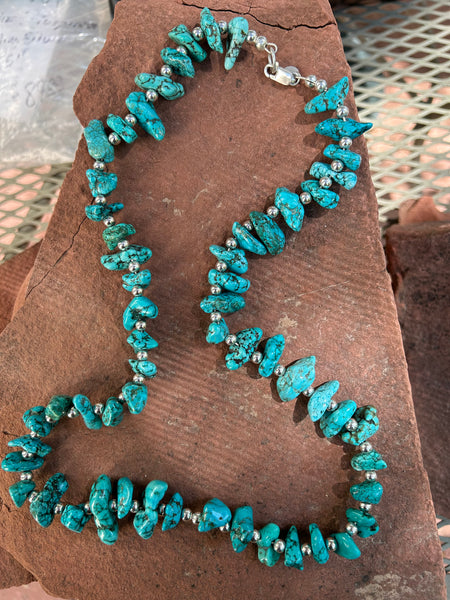 Genuine stabilized Turquoise nuggets with sterling silver beads and clasp.  25” by A.S.   AS 601
