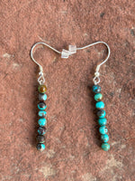Natural African Turquoise 4mm round bead earrings with Sterling silver.  SR107