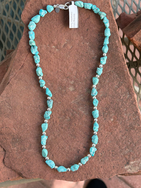 Campitos turquoise in a matte finish with sterling silver fashioned into a 20” necklace.  SR115 FREE SHIPPING IN THE CONTINENTAL USA.