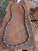Navajo style pearls with genuine Kingman turquoise in an adjustable length from 23” to 25”. SR116
