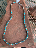 Navajo style pearls with genuine Kingman turquoise in an adjustable length from 23” to 25”. SR116