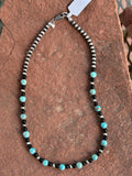 Genuine Turquoise with Genuine Black Onyx and sterling silver necklace in a 15” length. SR121