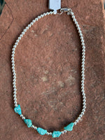 Genuine Campitos Turquoise nuggets in a matte finish, natural color with sterling silver 4mm beads.  15”.   SR122