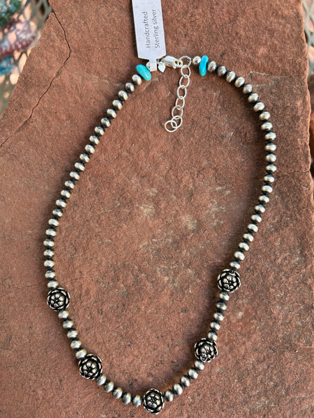 Sterling Silver necklace in oxidized beads and lotus flower beads.  Adjustable length from 15” to 17”. SR147