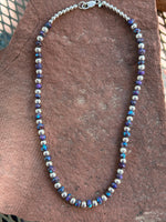 Kingman Turquoise with dyed purple turquoise composite with sterling silver beads. 18”  Z 1022