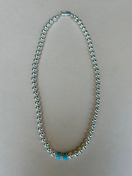 Grade AA Kingman Turquoise with Sterling silver in a 6mm bead size.  AS716. 16”