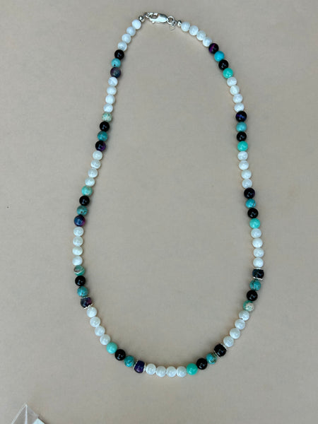 Genuine Mother of Pearl, black onyx, purple tiger eye, and sea sediment Jasper stones in a 20” necklace.  AS704