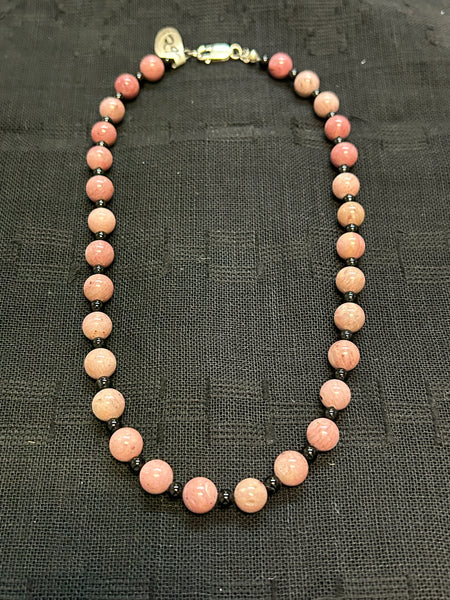 Genuine Rhodonite with black onyx and sterling silver.  16” long necklace. Clearance priced!