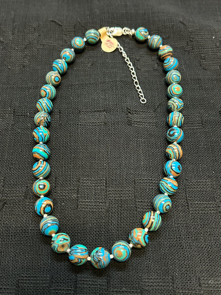 Clearance priced Mexican Calcite (lab) in 8 mm size with sterling silver and an adjustable clasp from 16 to 18