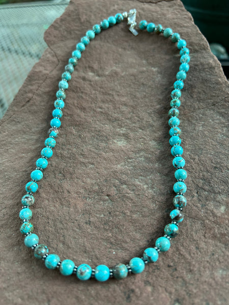 Genuine Turquoise beads, 6mm, with sterling silver accents and clasps.  18” long. SR1020