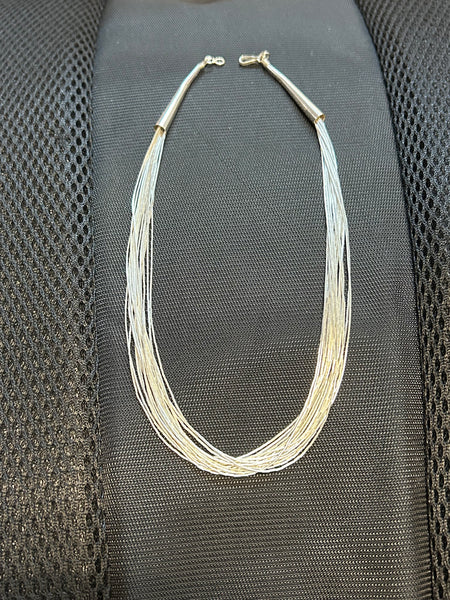 Sterling Silver “Liquid Silver” necklace with 15 strands and an 18” length.  SR1057
