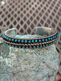 Navajo handcrafted sterling silver bracelet with genuine turquoise.  LZ064