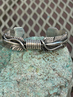 Navajo handcrafted sterling silver bracelet by Thomas Jr.  LZ068