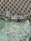 Navajo handcrafted sterling silver bracelet by Thomas Jr.  LZ068
