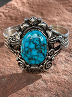 Navajo handcrafted sterling silver bracelet with genuine turquoise.  LZ041