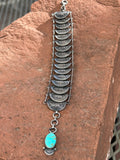 Navajo handcrafted silver Mercury dime bracelet with turquoise stone.  LZ044