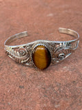 Navajo handcrafted sterling silver and Tiger Eye bracelet. LZ047