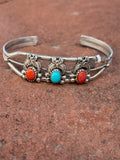 Navajo handcrafted sterling silver bracelet with turquoise and coral.  LZ053