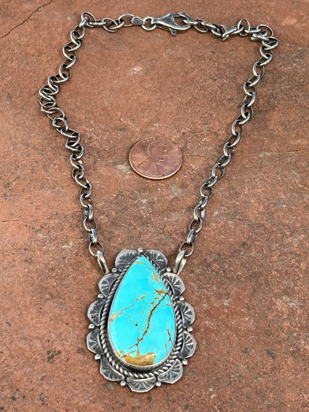 Navajo handcrafted necklace with sterling silver and genuine turquoise.  15” chain, 2” pendant, LZ084