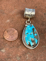 Navajo handcrafted sterling silver w/ genuine turquoise 2.25” top to bottom, LZ086