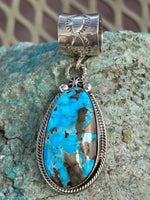 Navajo handcrafted sterling silver w/ genuine turquoise 2.25” top to bottom, LZ086