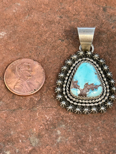 Navajo Handcrafted sterling silver with genuine turquoise, 1.75” top to bottom, LZ087