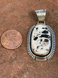 Navajo handcrafted sterling silver with White Buffalo Stone, 2” top to bottom, LZ089