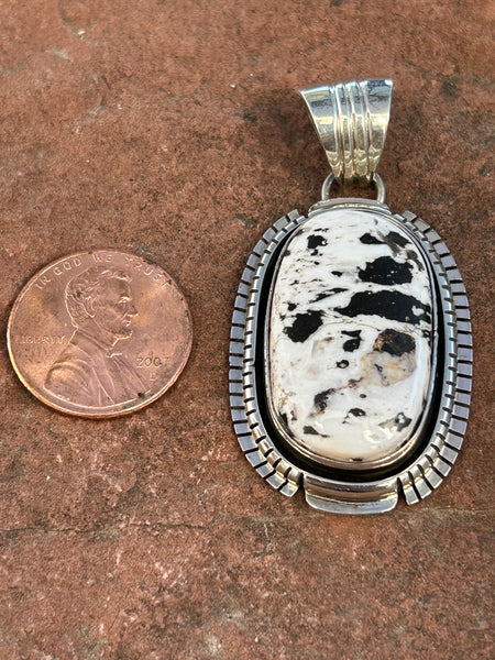 Navajo handcrafted sterling silver with White Buffalo Stone, 2” top to bottom, LZ089