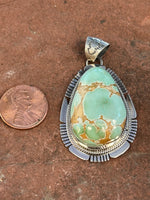 Navajo Handcrafted sterling silver, genuine turquoise, 2.25” top to bottom, LZ090