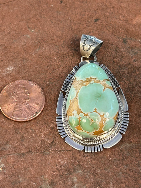 Navajo Handcrafted sterling silver, genuine turquoise, 2.25” top to bottom, LZ090