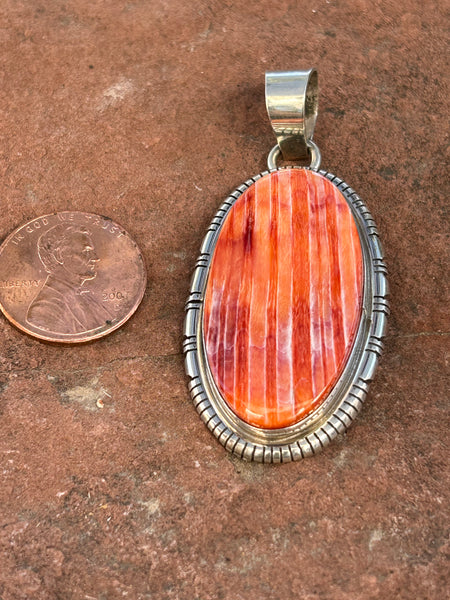Navajo handcrafted sterling silver with Spiney Oyster Shell stone, 1.75” top to bottom, LZ093
