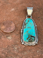 Navajo handcrafted sterling silver with genuine turquoise, 2.25” top to bottom, LZ094