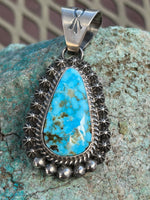 Navajo handcrafted sterling silver, genuine turquoise, 2.25 “ top to bottom, LZ096