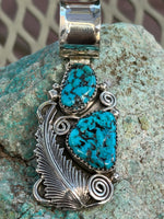 Navajo handcrafted sterling silver and genuine turquoise pendant, 2.5” top to bottom.  LZ102