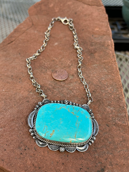 Navajo handcrafted necklace in sterling silver and Kingman turquoise.  16” chain, pendant is 2” x 2.5”.  LZ105