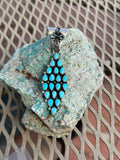Navajo handcrafted sterling silver with genuine turquoise and faceted Iolite. 3” top to bottom.  LZ107