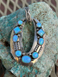 Navajo handcrafted in sterling silver and Lab Opal, 2.5” top to bottom, LZ110