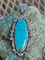 Navajo handcrafted sterling silver and genuine turquoise, by Angie Platero, 2.5” top to bottom, LZ111