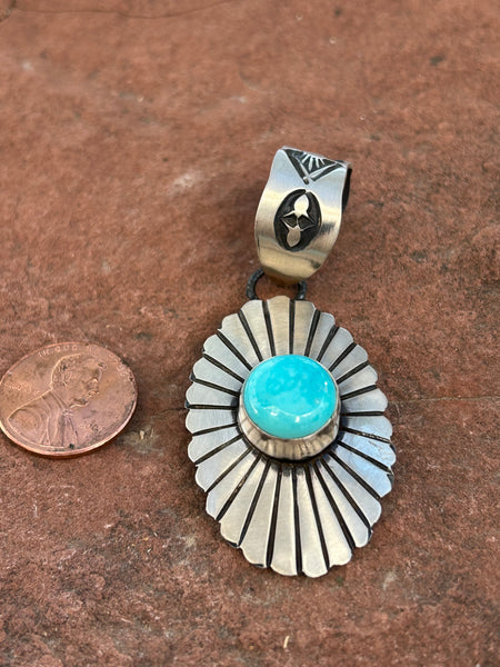 Navajo Handcrafted sterling silver and genuine turquoise pendant, 2.5” top to bottom. LZ113