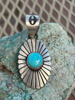 Navajo Handcrafted sterling silver and genuine turquoise pendant, 2.5” top to bottom. LZ113