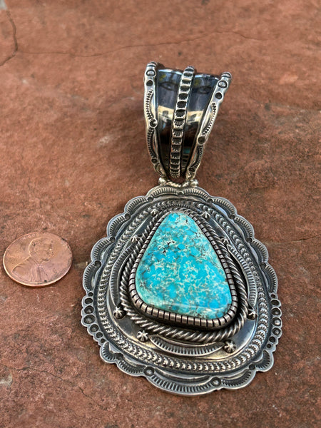 Navajo handcrafted sterling silver with genuine turquoise, by Hank Vanderer, 4.25” top to bottom, LZ116